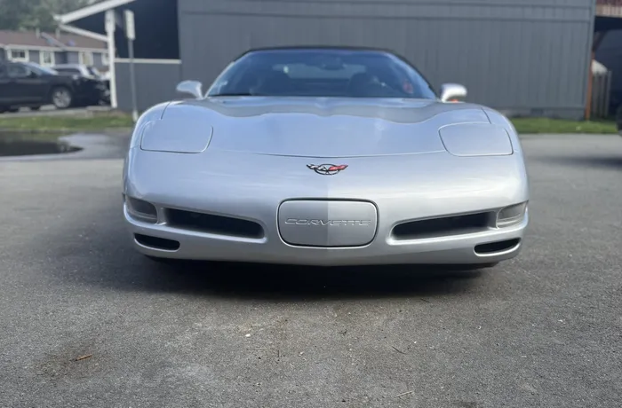 Front end of a ceramic-coated silver Corvette after a mobile detail in Anchorage
