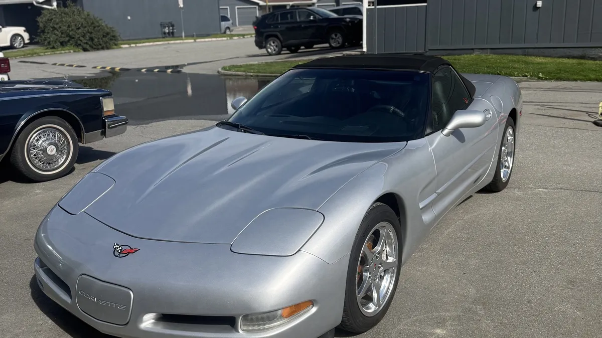 Ceramic-coated silver Chevrolet Corvette in an Anchorage driveway