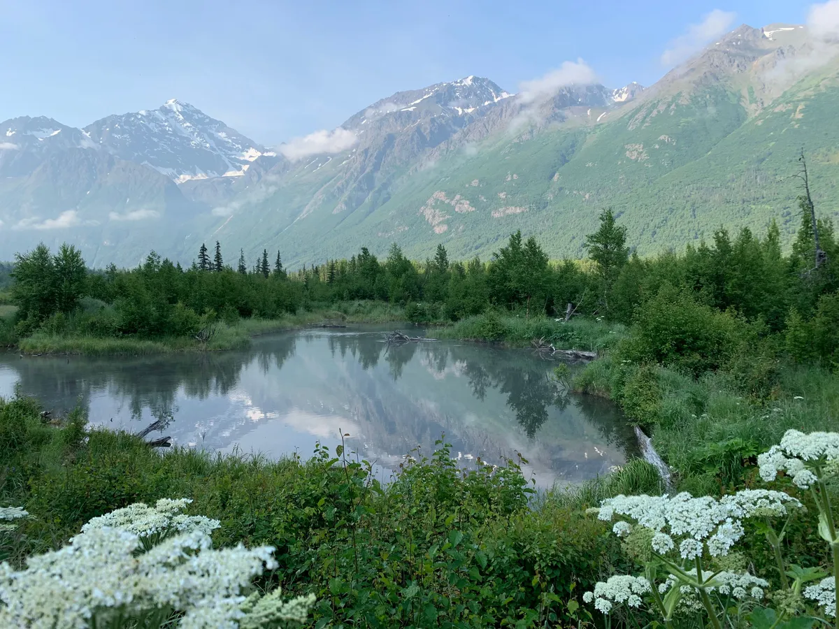 Eagle River valley with mountains and a still pond